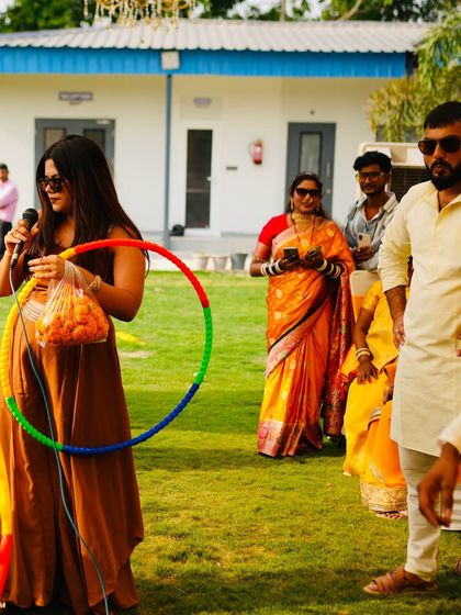 Getting ready for a hula hoop contest at an outdoor Mehendi. I always have a bag of props ready to turn any space into a playground.