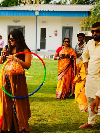 Getting ready for a hula hoop contest at an outdoor Mehendi. I always have a bag of props ready to turn any space into a playground.