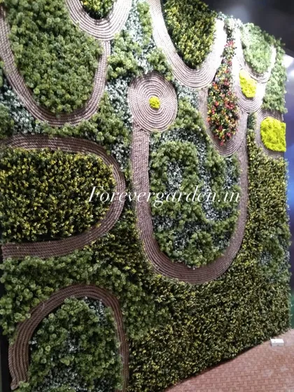 A highly customized green wall featuring intricate patterns made with rope, creating a unique and artistic landscape effect.