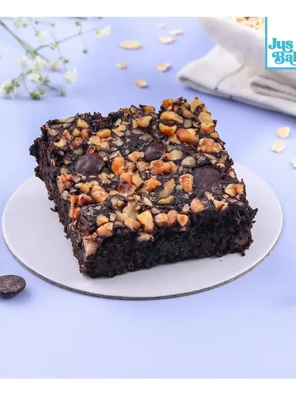 A closer look at the texture of our Oats Jaggery Brownie, showing the rich mix of ingredients.