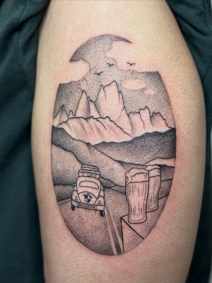 A close-up of the stipple shading on the travel tattoo, highlighting the texture created by the dots.