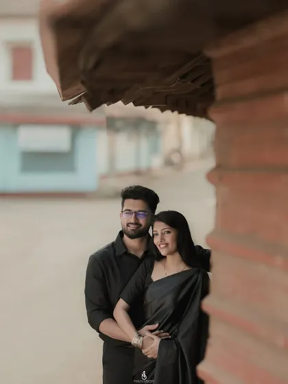 An intimate embrace, using architectural elements to frame the couple. This adds depth and interest to the urban portrait.