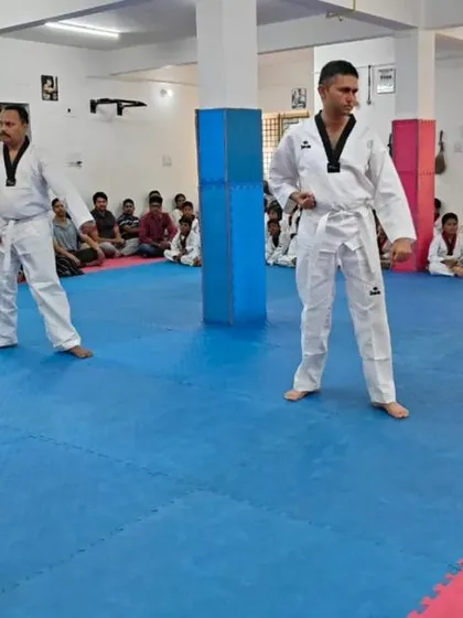 Two senior students in a ready stance.