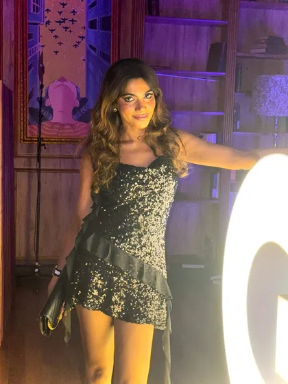 A candid shot from the GQ party, enjoying the glamorous atmosphere.