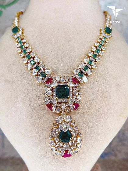 This necklace is heavy in craftsmanship and grand in its presence. I designed it by combining large uncut diamonds with heirloom-scale emeralds and rubies for a clean, bold, and unforgettable bridal statement piece.