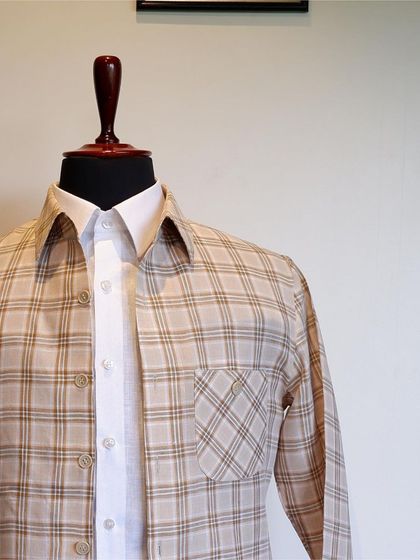 Crafted with meticulous attention to detail, its subtle stripes and relaxed fit effortlessly exude confidence.