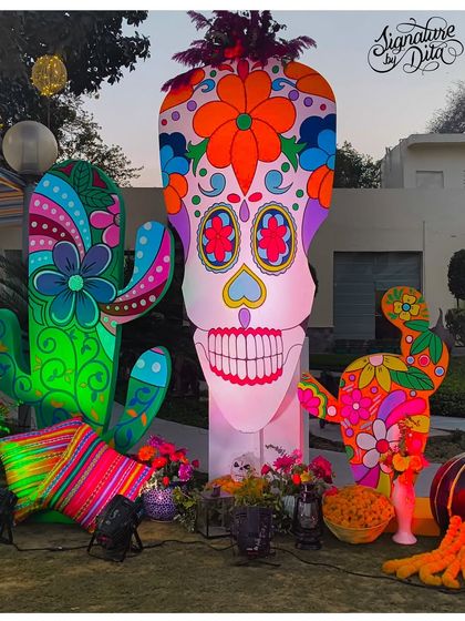 The giant sugar skull and cactus props illuminated as evening approaches. The internal lighting gives them a whole new dimension and ensures they remain a focal point after dark.