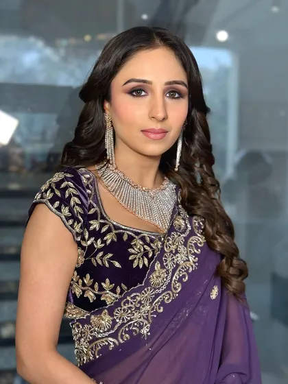 Another angle of the chowki look, showing the beautiful diamond jewelry and the soft curls in her hair.