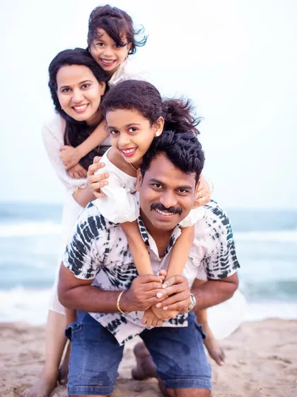 Another angle of this joyful family pose, capturing genuine smiles and laughter. It shows how we can create a variety of beautiful, connected portraits from a single fun idea.