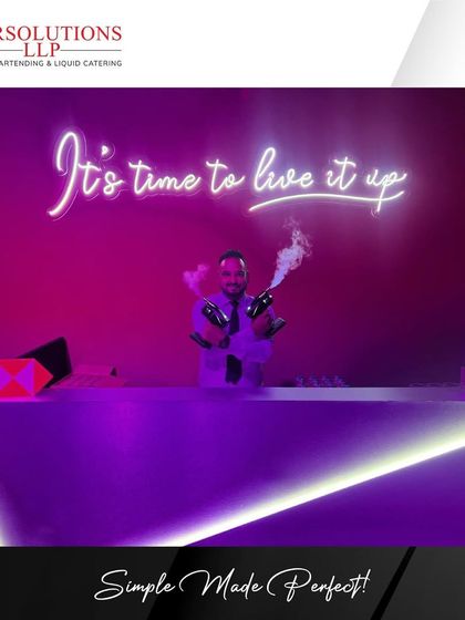 A flair bartender entertains guests at the HSBC launch, adding a dynamic element to the evening.