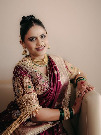 A beautiful smile from our Maharashtrian bride. The makeup is designed to feel comfortable and look fresh for hours, allowing her to enjoy her special day to the fullest.