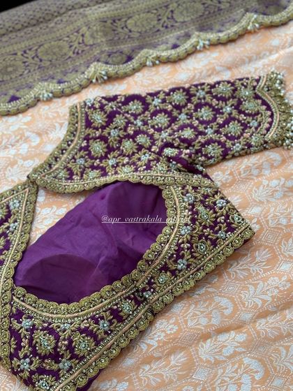 A purple blouse with all-over floral zardosi work.