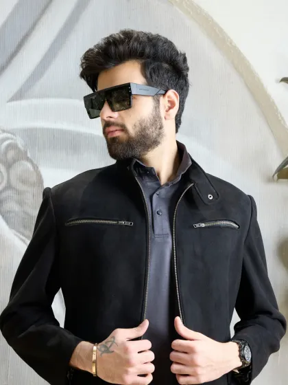 The black wool-blend biker jacket, shown here with its sleek silhouette and zipper details, is an essential piece for a modern, sophisticated wardrobe.