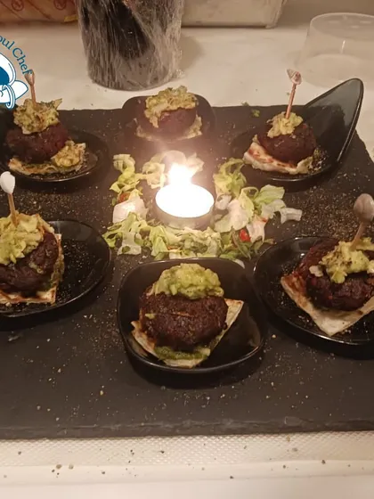 Beetroot kebabs served on a dark slate, creating a beautiful color contrast.