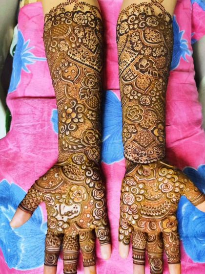 A personalized design with the name 'Shifa' on the palm, surrounded by delicate floral work.