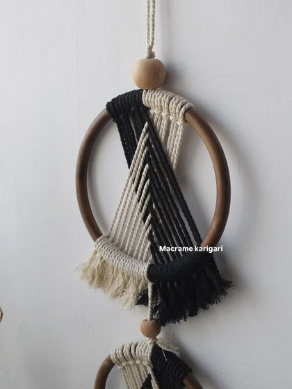 A close-up of the top ring of our 'Ringoz' wall hanging, showing the clean lines and contrasting colors of the design.