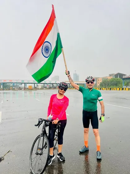 A couple from our group posing with the flag after the Independence Day ride.