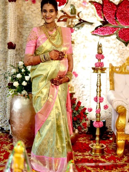 A full-length view of Savitha at her Sreemantham. The lightweight tissue silk drapes beautifully, ensuring comfort and elegance.