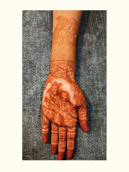 The final, mature stain of the Radha-Krishna portrait. The color has deepened to a beautiful dark brown, showcasing the quality of my organic henna.