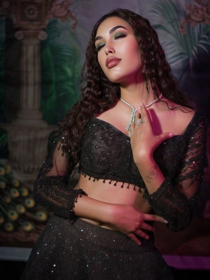 Bold eyes and fierce confidence. This look features a dark, smokey eye and glossy lips, perfect for a night out.