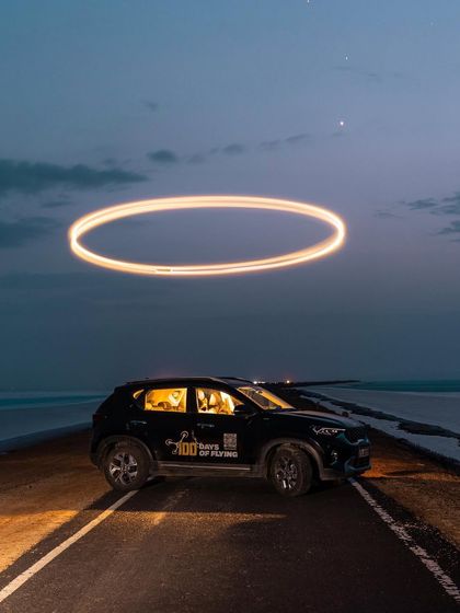 A long-exposure shot of my car with a drone light halo, symbolizing the journey of chasing dreams. Some days the vision turns into visuals, other days are for learning.