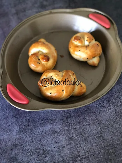 Look at these golden, soft dinner rolls, fresh from my oven in Cochin. I love shaping them into these little knots, and they are perfect for soaking up gravy or enjoying with a bit of butter.