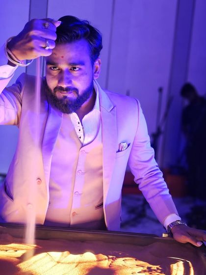 A photo from my live sand art show for Protiviti in Chennai. The focused lighting helps create a dramatic atmosphere for the performance.