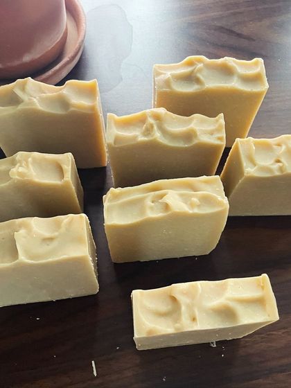 A collection of freshly cut Multanimitti Avocado Butter soap bars. The rustic, wavy tops are a signature of my handmade batches. Each bar is cured for weeks to ensure it's gentle and long-lasting.