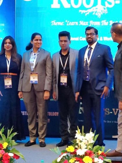 Standing with my colleagues on stage after a successful session at the Roots conference. Teamwork and shared knowledge are vital in our field.