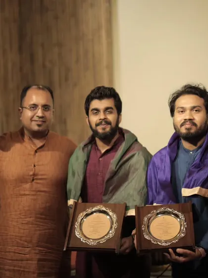 A series of photos from a baithak-style concert in Delhi with sarod player Pratik Shrivastav bhai. The intimate setting allows for a deeper connection with the audience.