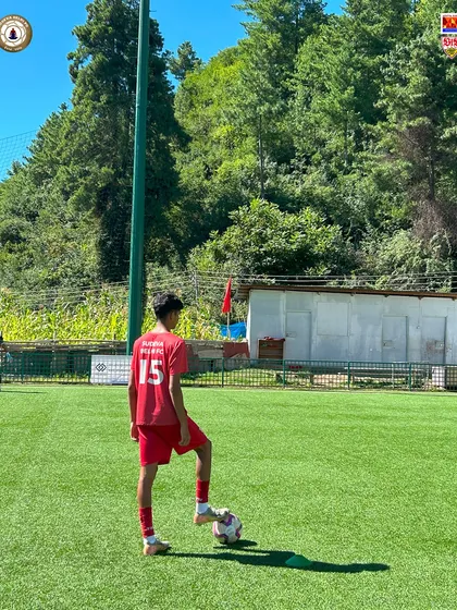 A moment of focus before the drill. A Sudevan stands with the ball, ready for the next instruction during our international tour in Bhutan.