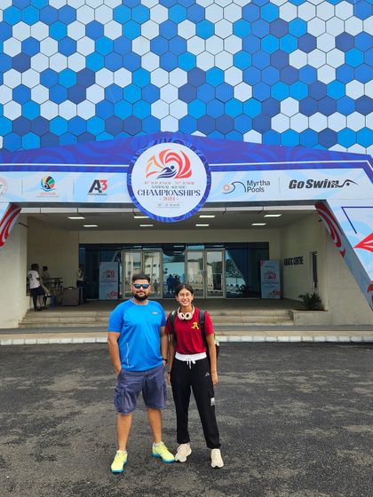 Standing with a history-maker at the Senior National Championships. My swimmer Prapti Ghose proved her all-around athletic ability by qualifying in every stroke, a result of our comprehensive training approach.