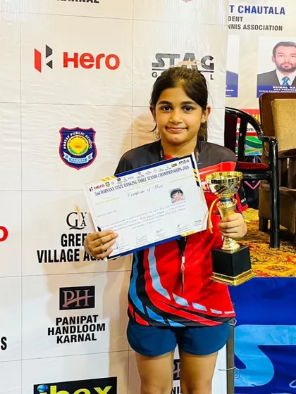 A close-up of our young champ, Prisha Agarwal, with her bronze medal trophy and certificate. Her performance at the Haryana State Ranking Championship is a result of consistent practice and a strong competitive spirit.