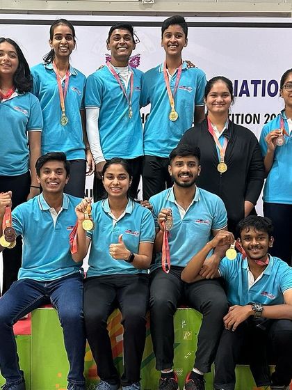 The victorious team on the podium at the Nagaraja Jagdale State Shooting Competition.