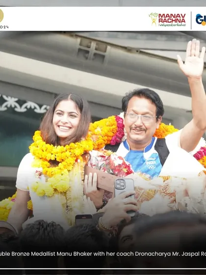 A heartwarming moment as double bronze medalist Manu Bhaker is welcomed with garlands upon her return from the Paris Olympics, accompanied by her coach.