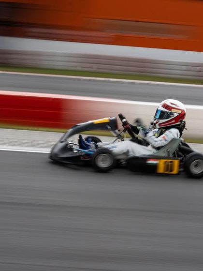 A driver in our number 10 kart at speed during the RMC Asia Trophy.