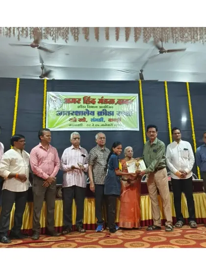 Another one of our players being felicitated for his performance.
