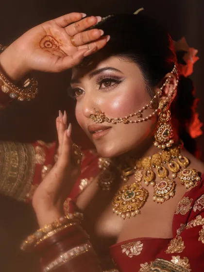 A classic pose, capturing the timeless beauty of an Indian bride.