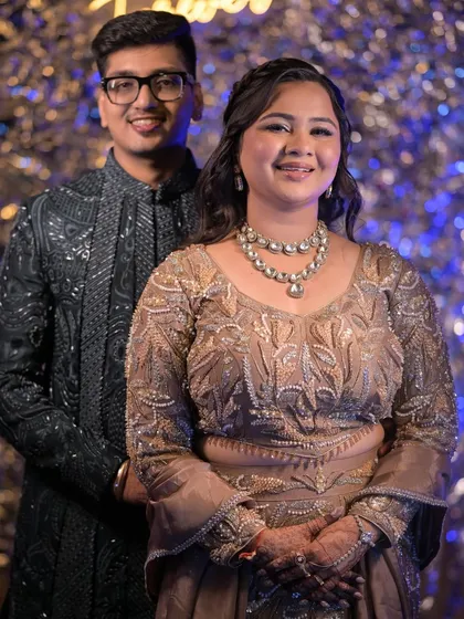 A lovely couple portrait from the sangeet, with the bride's makeup and layered necklace taking center stage.