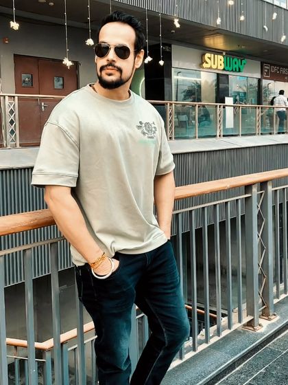 A confident pose during a day out. The aura you build in the gym extends to all parts of your life.