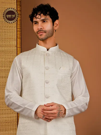 Effortless elegance in every thread. An off-white textured Nehru jacket paired with a matching kurta, a classic and versatile choice.