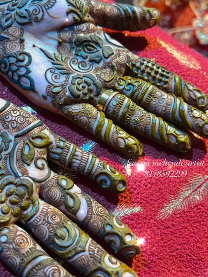 A close-up of a beautiful, intricate design. The details on the fingers are so delicate.