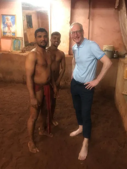 Our akhada welcomes visitors from all over the world. Here, a guest from abroad experiences the traditional 'lal mati' pit firsthand at the Lakshmi Narayan Kusti Akhada in Mumbai.