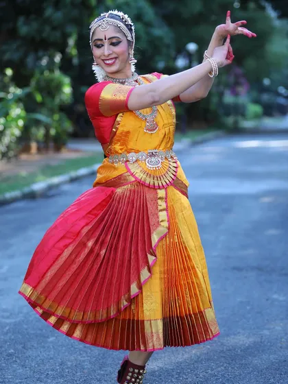 A lovely outdoor shot from Remya’s Arangetram photoshoot. The swirl of the costume and the joyful expression capture the dynamic beauty of the dance.
