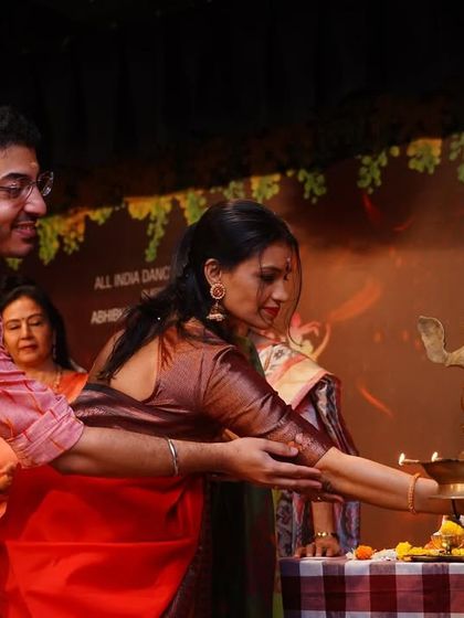 Another moment from the lamp lighting ceremony, a sacred tradition to mark the beginning of an auspicious event.