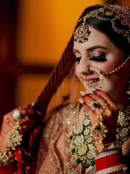 A candid moment of laughter. The bride's joy is palpable, and her jewellery adds to the celebratory feel.
