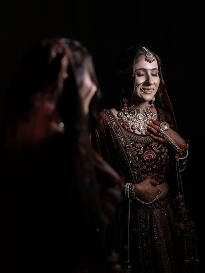 A moment of pure happiness. The bride's smile is the centerpiece, enhanced by a makeup look that is both radiant and joyful.
