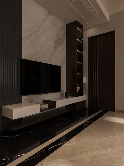 The TV wall features a dramatic combination of black marble flooring, a white marble accent wall, and dark fluted paneling, showcasing a masterful play of materials.