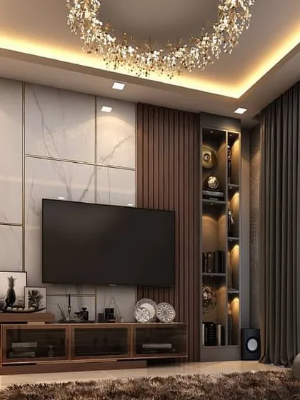 A 3D rendered TV unit designed by our team. It features a large marble-look back panel, a vertical display cabinet, and a stunning crystal chandelier, creating a luxurious and grand entertainment space.