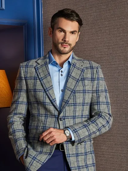 A front-on view of the grey and blue plaid jacket. The pattern is perfectly matched at the seams, a subtle but important sign of high-quality tailoring.